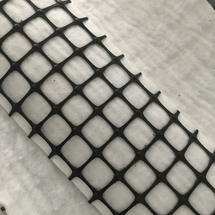 Geomalla compuesta de fibra de vidrio con geotextil hilado